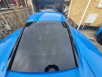 Emira Mine stickers on rear window.webp