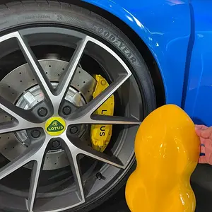 Lotus Emira - Hethel Yellow vs Brake Caliper vs Lotus Badge.jpg