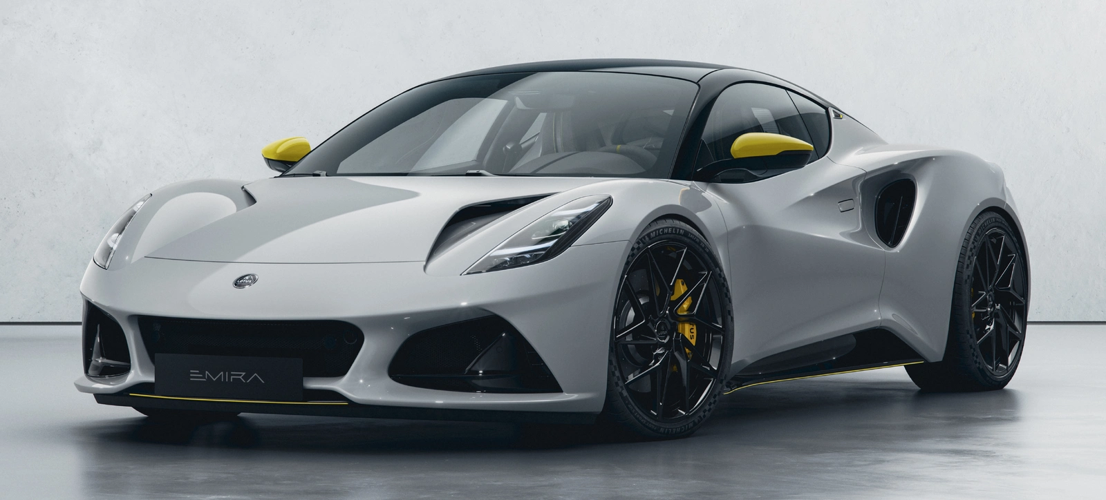 Emira-Turbo-SE-Racing-Line-Ice-Grey-Yellow-Accents.webp